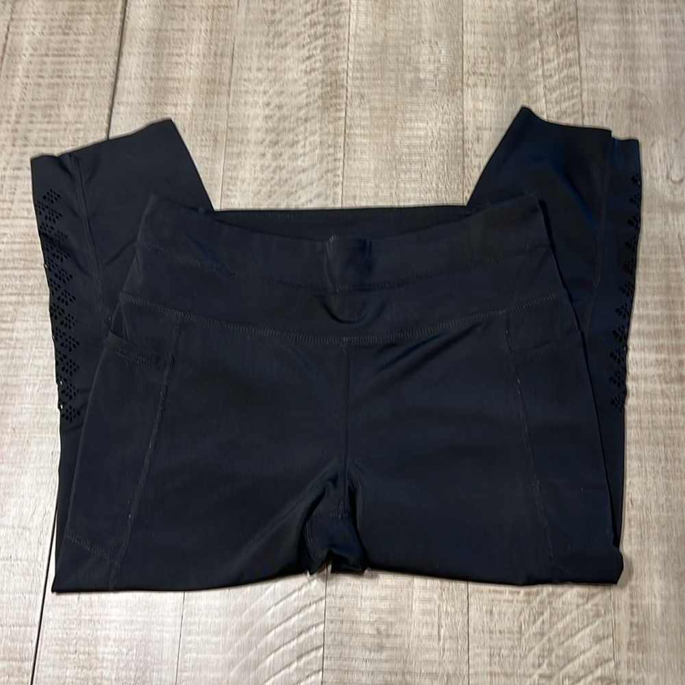 3:$25 Tangerine capri leggings with cute cut outs down outside of each calf. - Picture 2 of 5